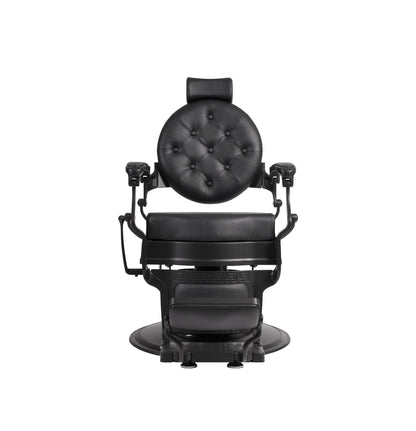 Black barber chair with tufted backrest on a white background